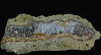 Natrolite and calcite on petrified wood - Sipi caves - Mount Elgon - Manafwa distr. - Uganda